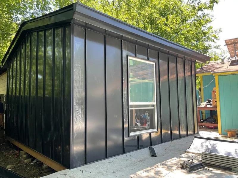 Black standing seam metal wall panels for Roof Inspection in Shady Hills